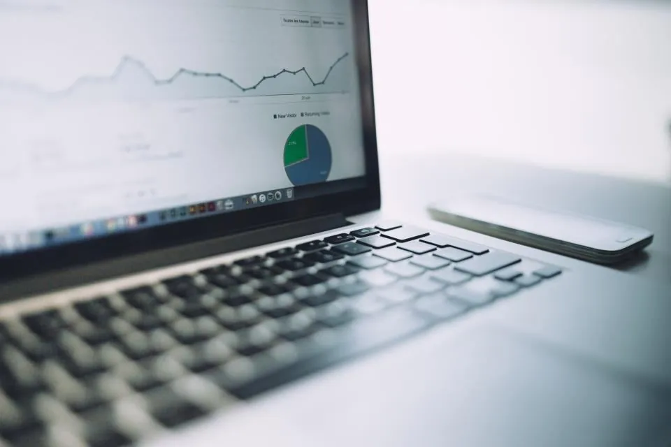 Laptop showing analytics charts, for search and AI visibility